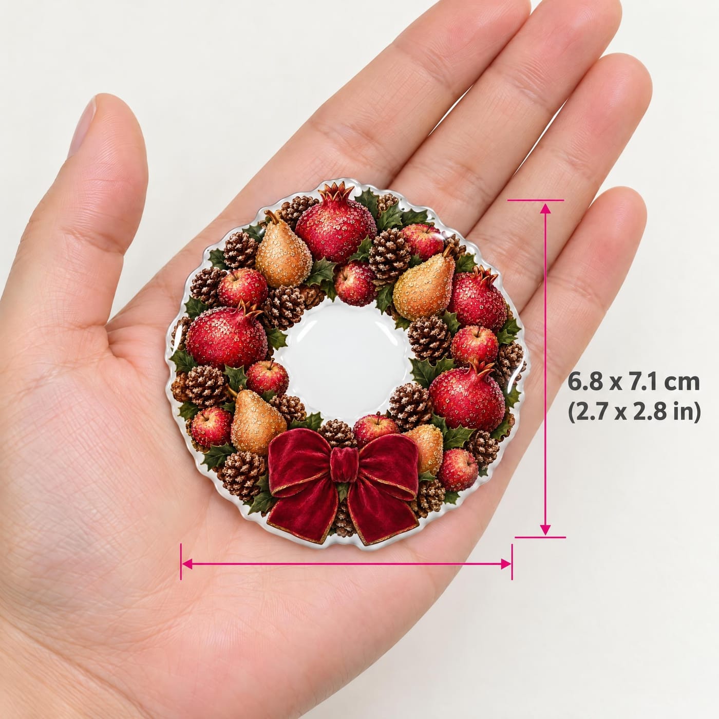 Sugared Fruit Wreath Christmas Resin Fridge Magnet shown in hand for scale